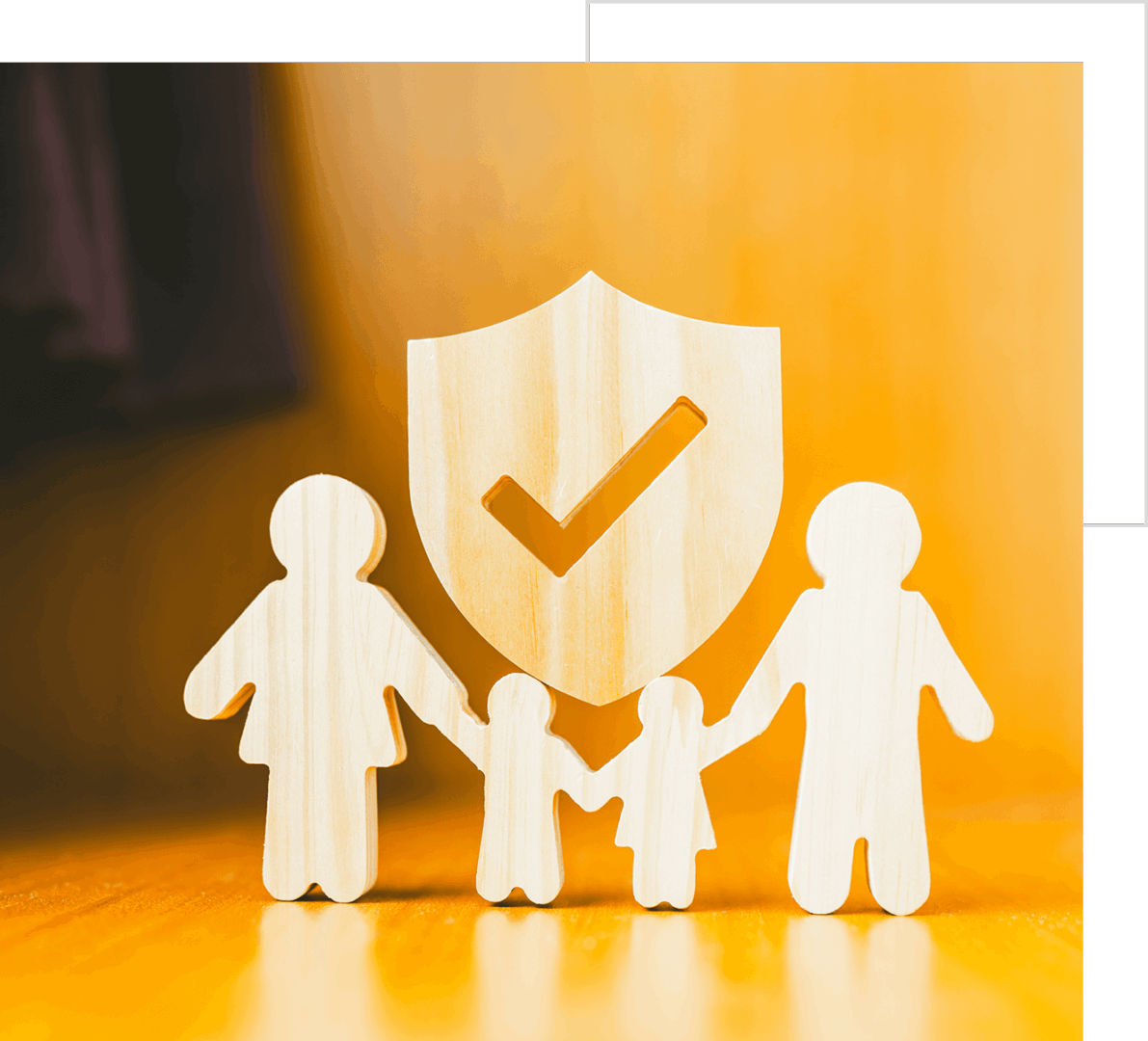 Paper cutout family holding hands with a shield and checkmark symbolizing protection and security.